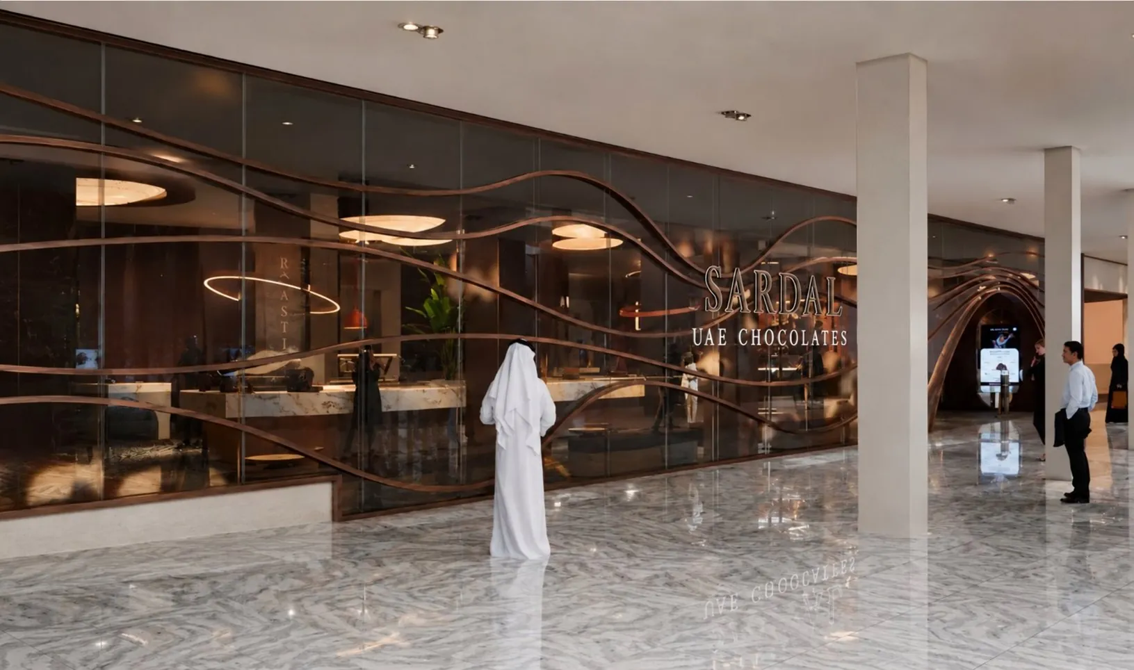 The Sardal flagship store, a glass front with flowing bronze ribbons and the sign Sardal UAE Chocolates